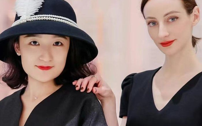 Two guests styled with hats and accessories